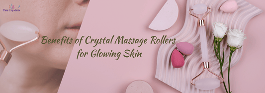 Woman using a rose quartz crystal roller on her face as part of her skincare routine. Close-up of a rose quartz facial roller with soft pink hues on a baby pink backgroun.