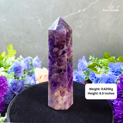 Premium Amethyst Jumbo Tower with weight and height information on a gray background with flowers.