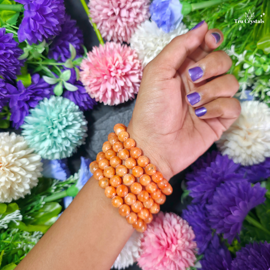 Natural Orange Calcite crystal bracelet with warm peach and orange beads for joy, creativity, positivity and Sacral Chakra intentions by TruCrystals
