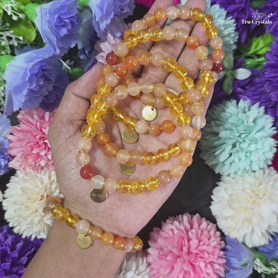 Numerology Bracelet for Missing Number 1  &  Planet Sun containing citrine , sunstone and orange carnelian with dark background.