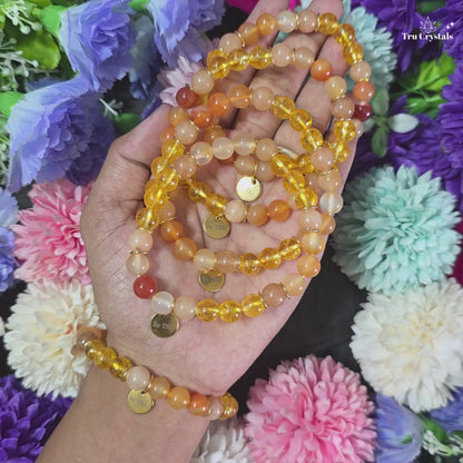 Numerology Bracelet for Missing Number 1  &  Planet Sun containing citrine , sunstone and orange carnelian with dark background.