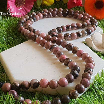 Rhodonite Crystal Japa mala: To achieve your Highest potential