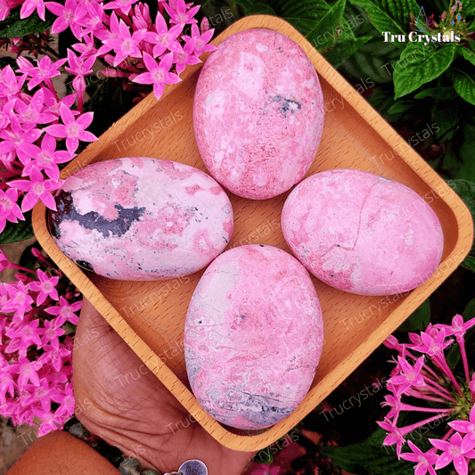Rhodochrosite Palm Stone to Tender and Loving Energies